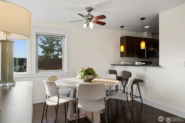 a dining room with furniture and window