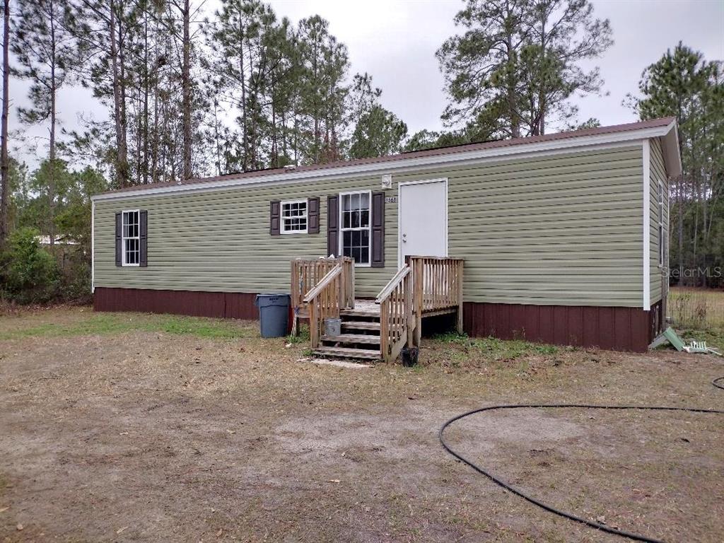 1568 Hazelnut Street Bunnell, FL 32110 - Photo 11 of 19 a view of a house with a patio