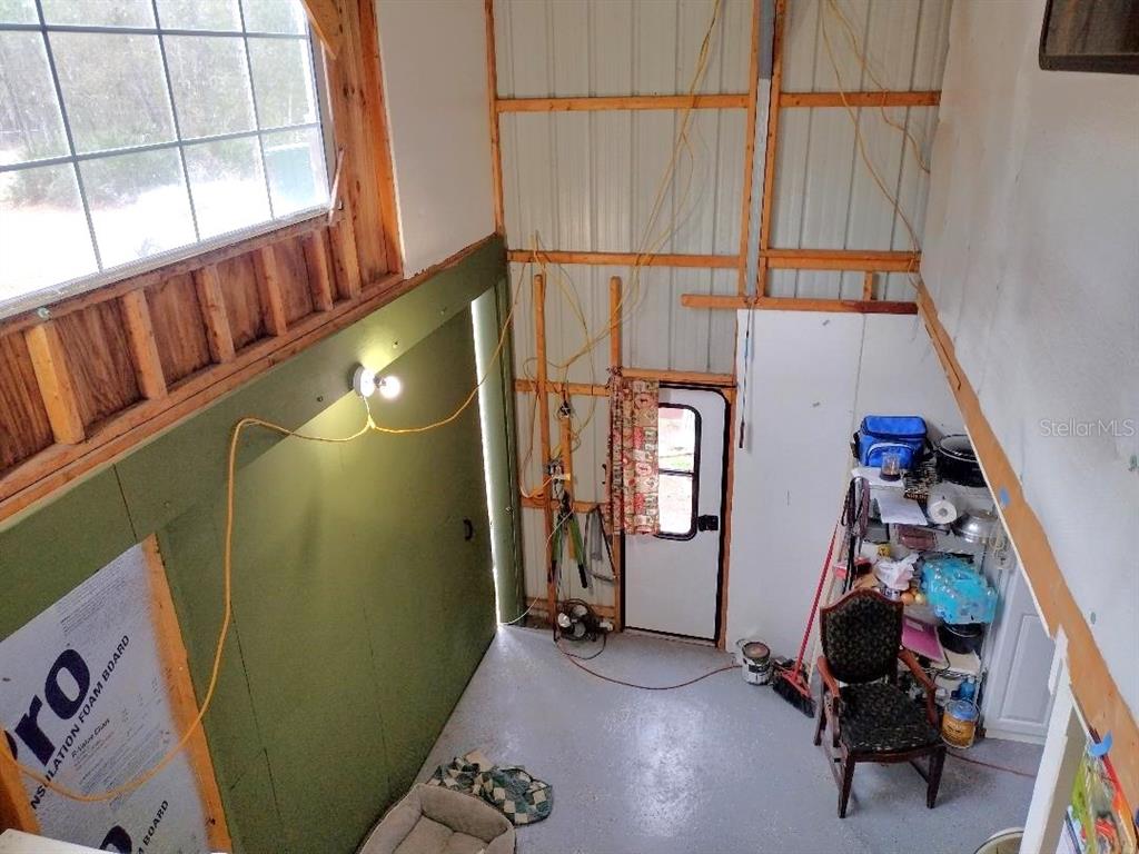 1568 Hazelnut Street Bunnell, FL 32110 - Photo 16 of 19 a room with window and furniture