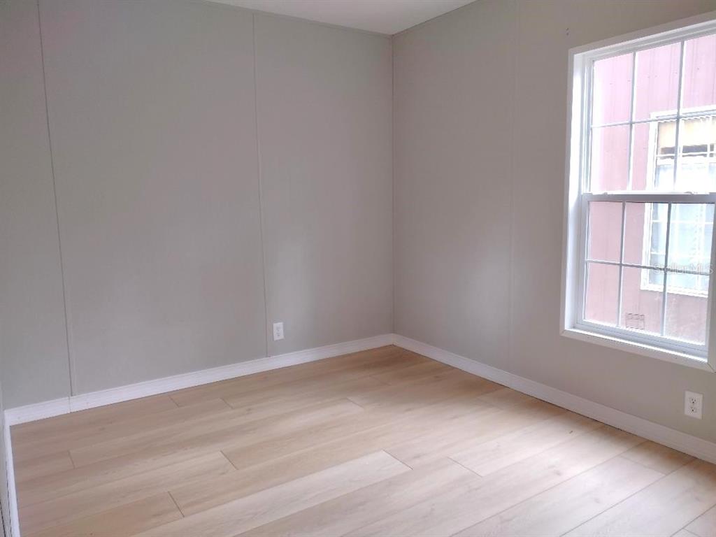 1568 Hazelnut Street Bunnell, FL 32110 - Photo 9 of 19 an empty room with a window