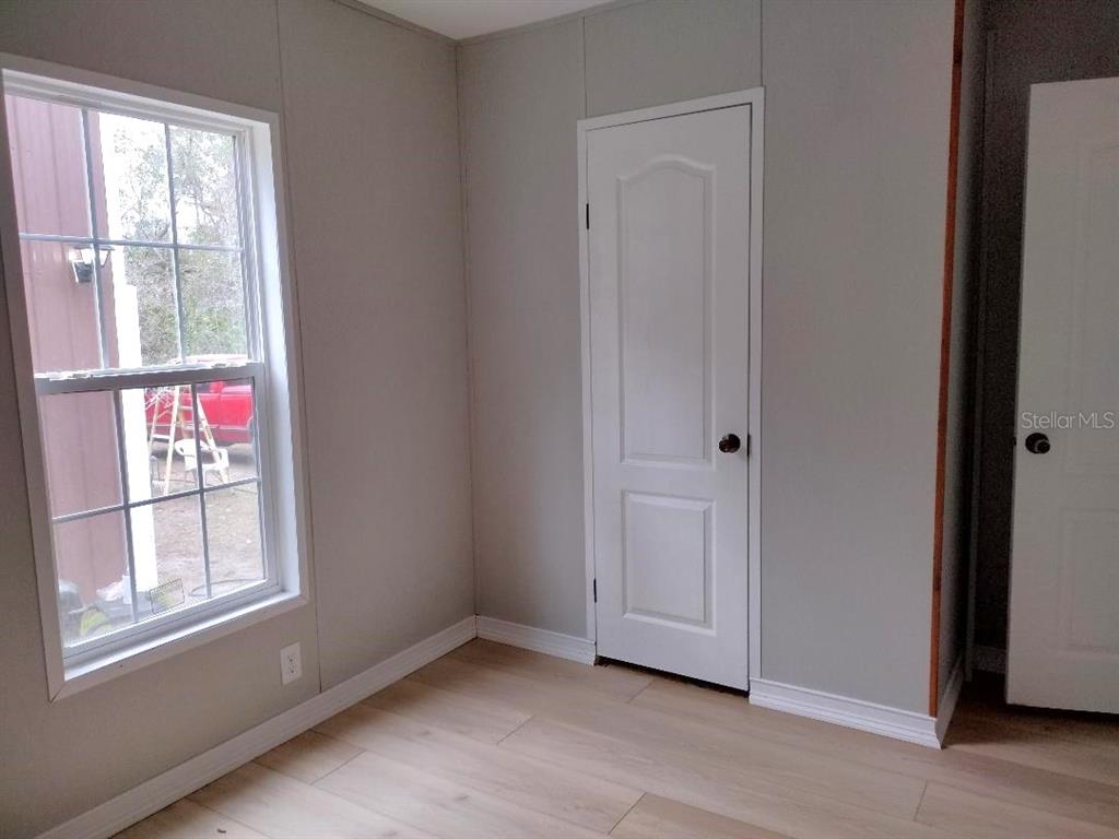 1568 Hazelnut Street Bunnell, FL 32110 - Photo 10 of 19 an empty room with windows