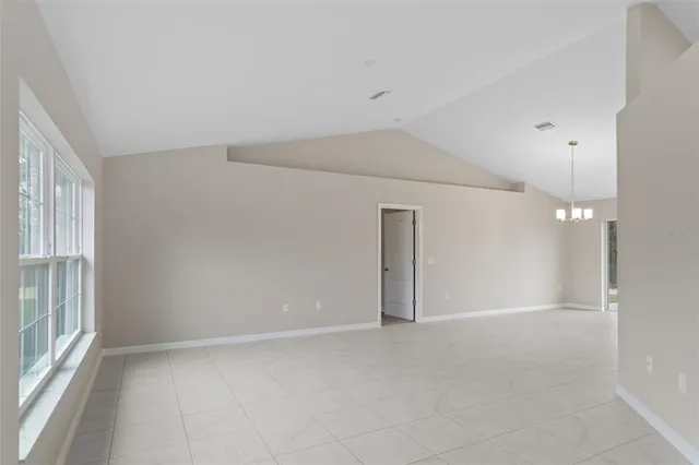 a view of a room with windows and chandelier