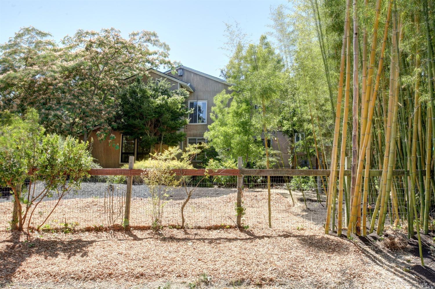 7274 Elphick Road Sebastopol, CA 95472 - Photo 1 of 1 a patio with table and chairs and potted plants