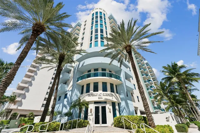 a front view of a multi story residential apartment building with entryway