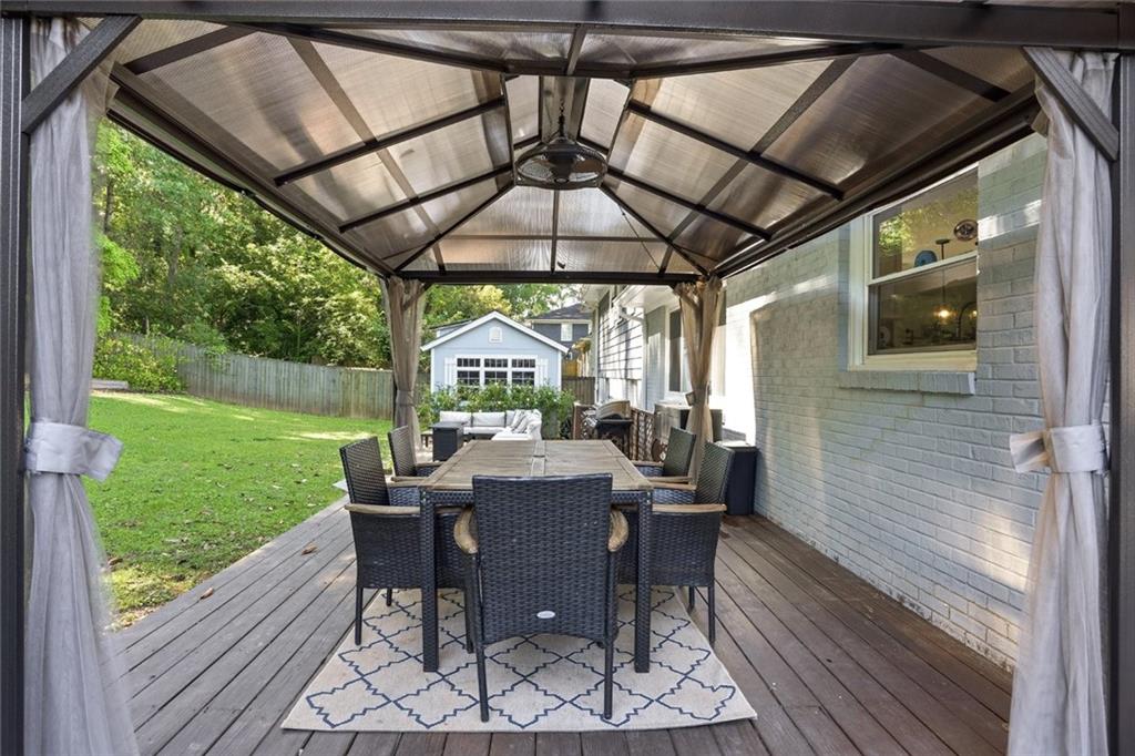 1430 Thomas Road Decatur, GA 30030 - Photo 32 of 42 a view of a porch with furniture and a yard