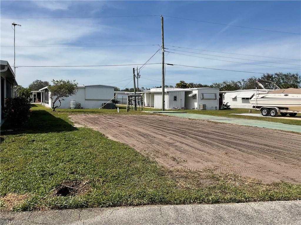 143 Rose Lane Naples, FL 34114 - Photo 4 of 13 a view of a parking space