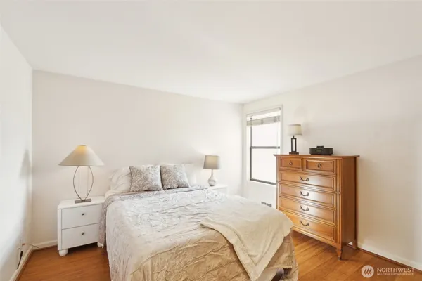 a bedroom with a bed and a closet