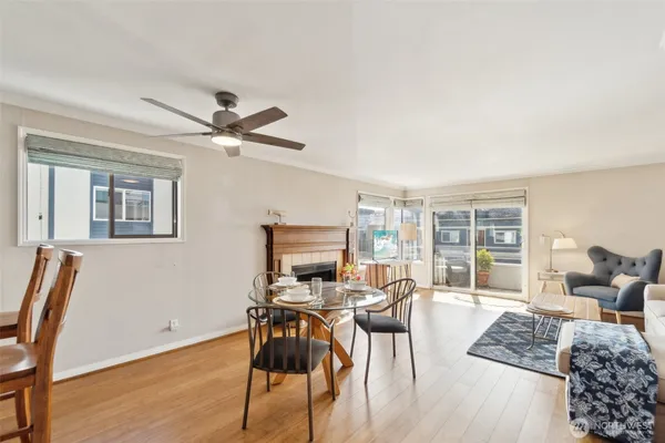 a view of a livingroom with furniture and a ceiling fan