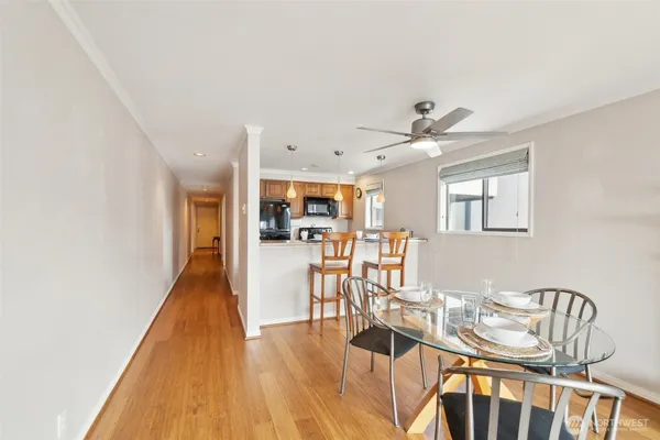 a view of a dining room with furniture and wooden floor