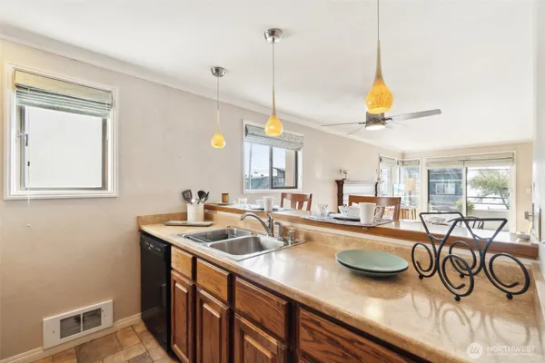 a kitchen with sink and breakfast area