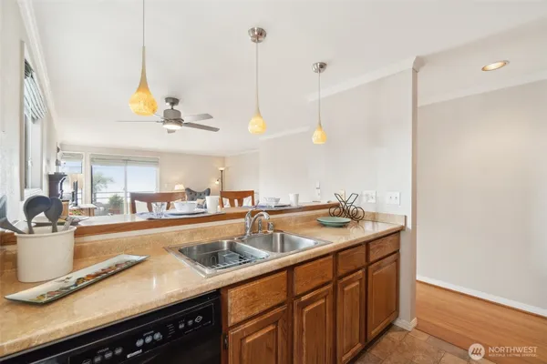 a kitchen with a sink and stove