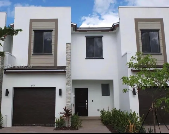 a front view of a house with a garage