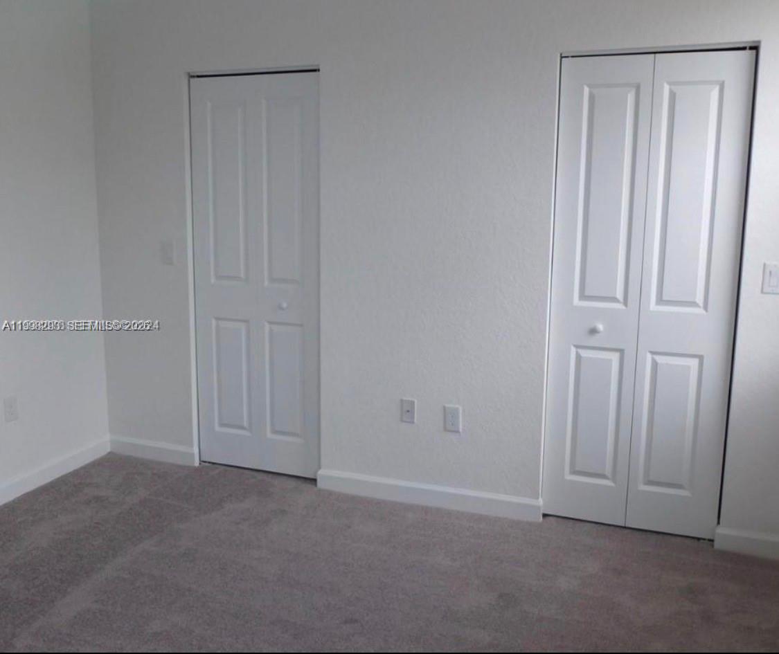 407 Northeast 208th Terrace Miami, FL 33179 - Photo 6 of 7 His & Hers WC
