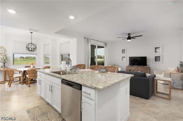 a kitchen with a counter top space a sink and a stove