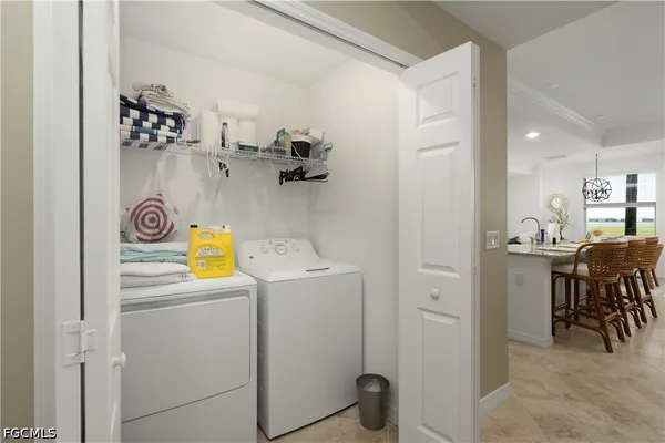 a view of a storage & utility room with washer and dryer