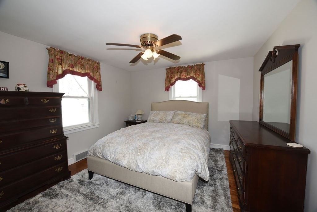 106 Rinaldo Road Weymouth, MA 02191 - Photo 16 of 39 a bedroom with a bed and a dresser