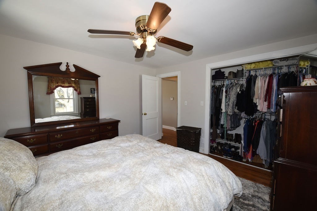 106 Rinaldo Road Weymouth, MA 02191 - Photo 18 of 39 a bedroom with a bed and a chandelier