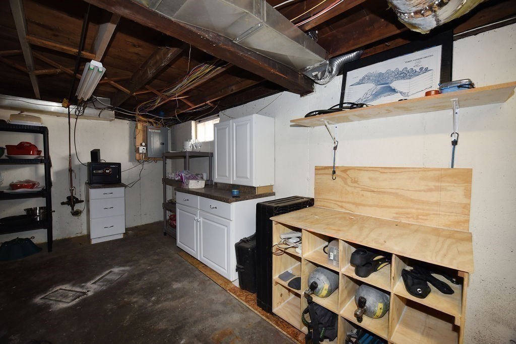 106 Rinaldo Road Weymouth, MA 02191 - Photo 30 of 39 a kitchen with a sink and cabinets