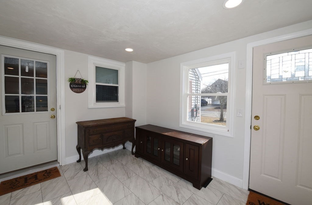 106 Rinaldo Road Weymouth, MA 02191 - Photo 3 of 39 a living room with furniture and a window