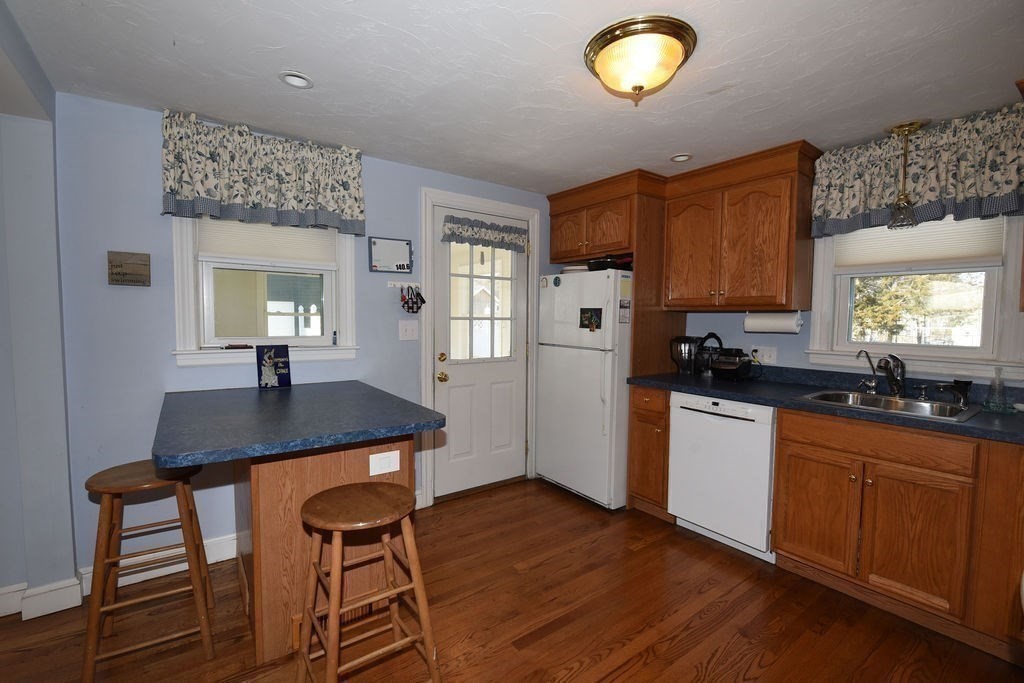106 Rinaldo Road Weymouth, MA 02191 - Photo 5 of 39 a kitchen with sink cabinets and appliances
