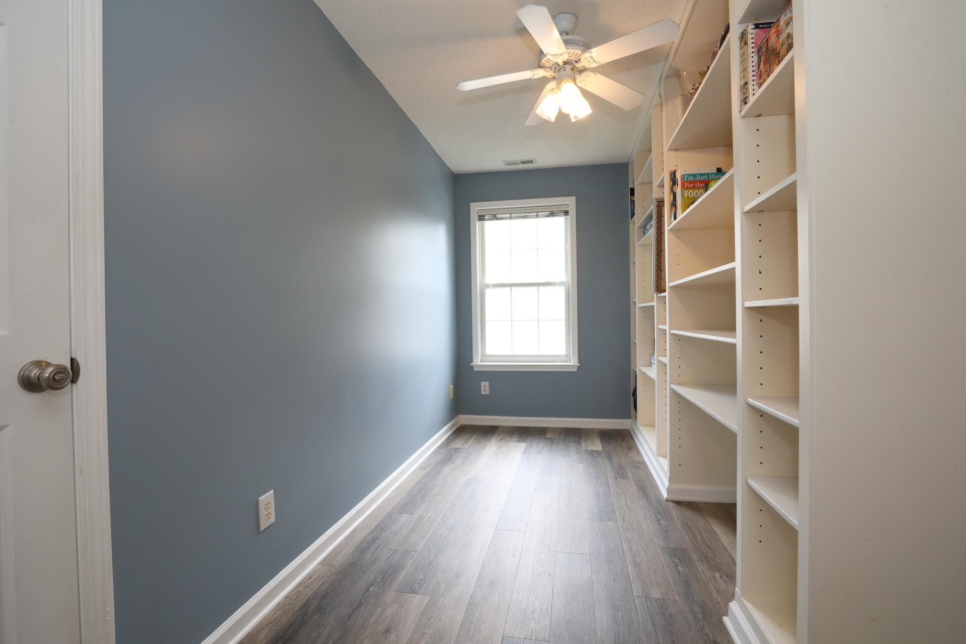 110 Ridge Lake Drive Apex, NC 27539 - Photo 19 of 26 The bonus room is split into two smaller rooms by a large bookcase and wall that was built down the middle. This is the front half with the bookcase. Bonus Room