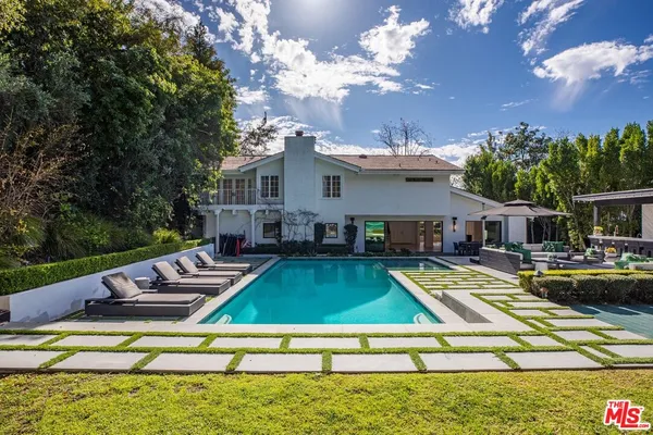 a view of a house with swimming pool