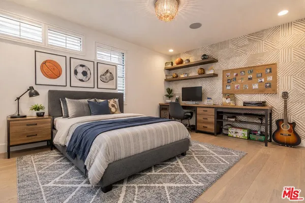 a bedroom with a bed and furniture