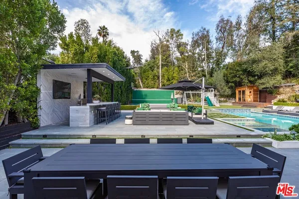 a view of a wooden deck and a patio