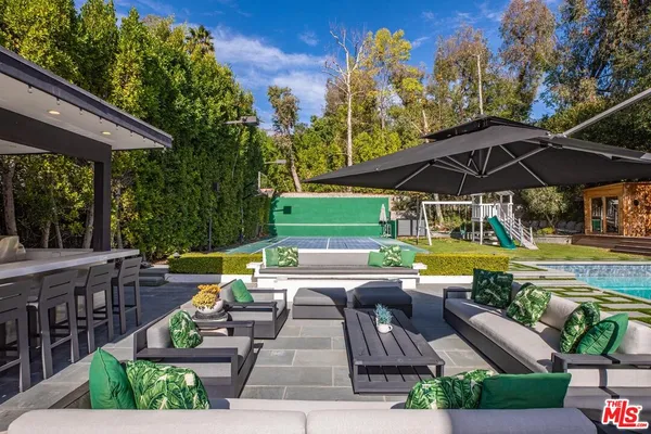 a view of yard with seating area and green space