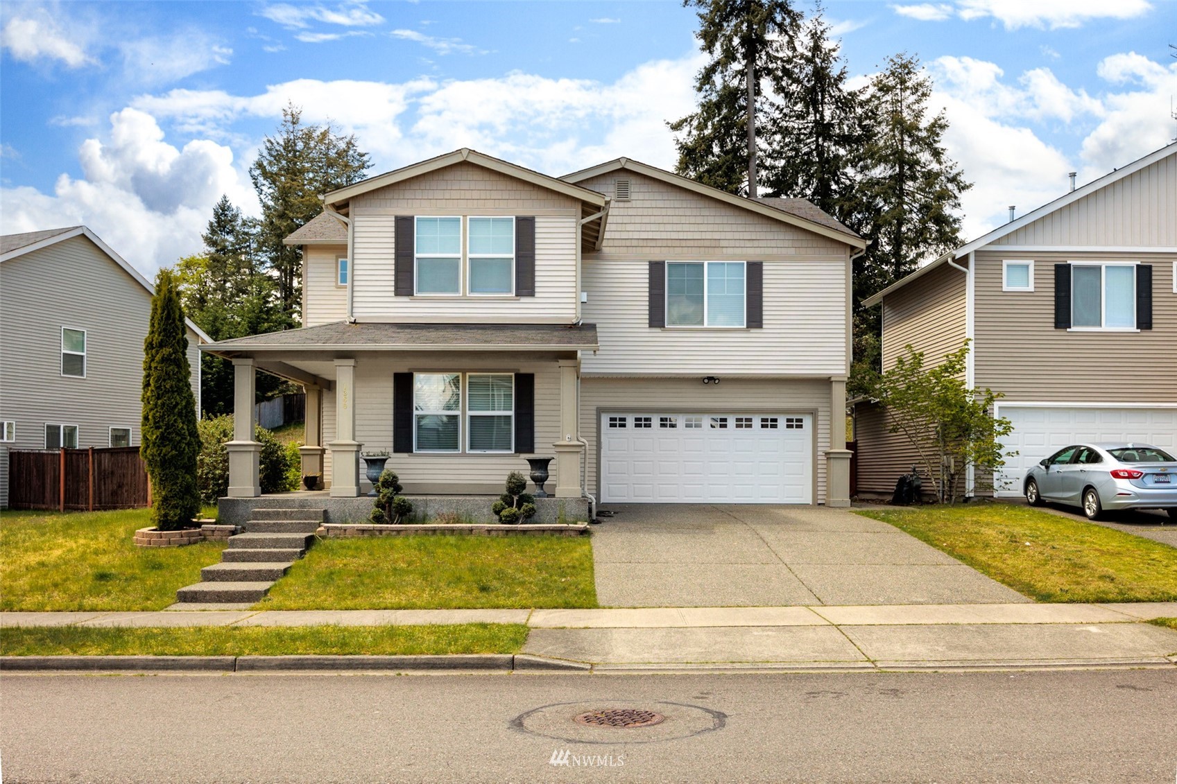 1360 Foreman Road DuPont, WA 98327 - Photo 1 of 33 a view of a house with swimming pool and sitting area