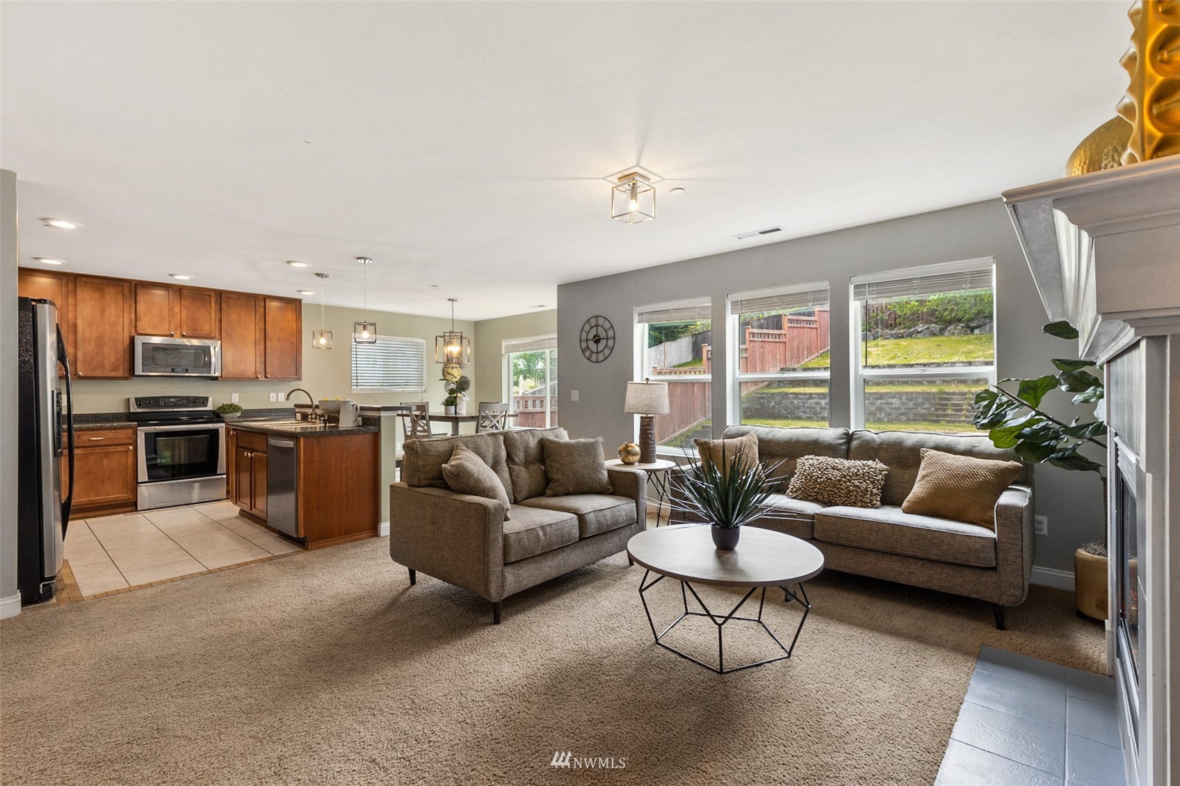 1360 Foreman Road DuPont, WA 98327 - Photo 12 of 33 a living room with furniture kitchen view and a large window