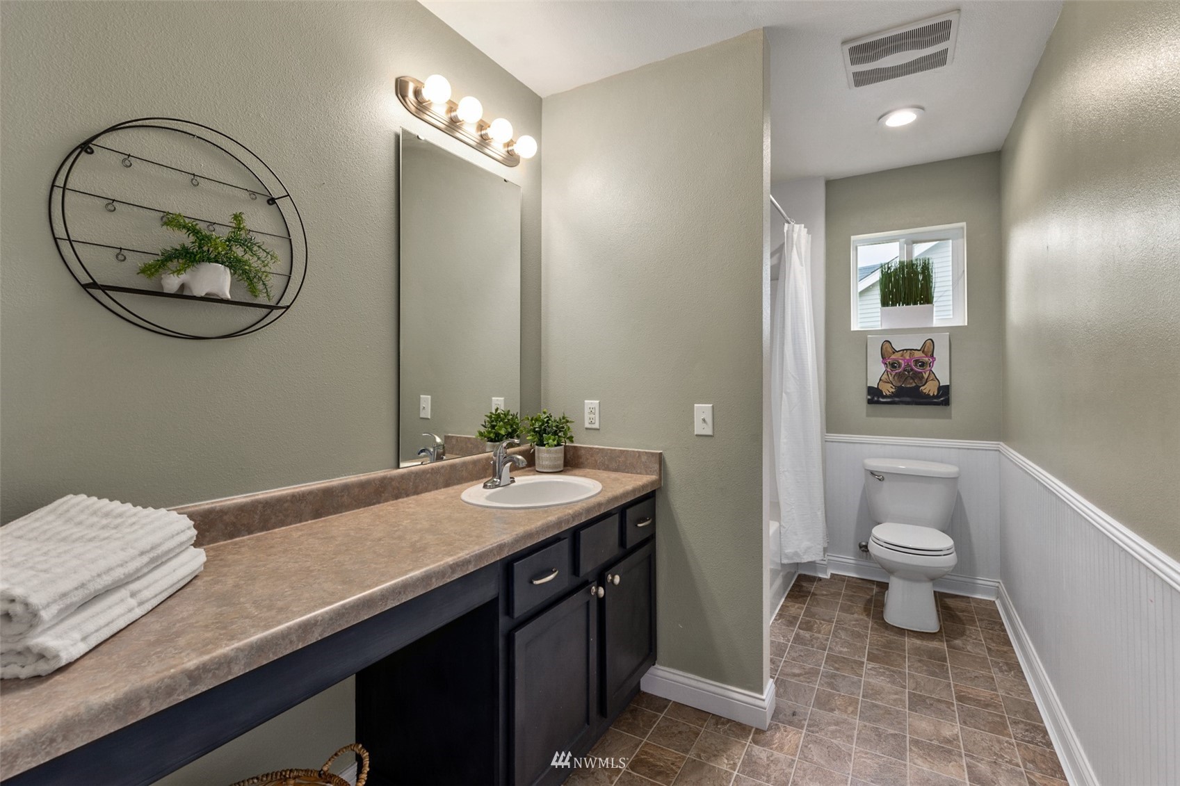 1360 Foreman Road DuPont, WA 98327 - Photo 20 of 33 a bathroom with a granite countertop sink and a mirror