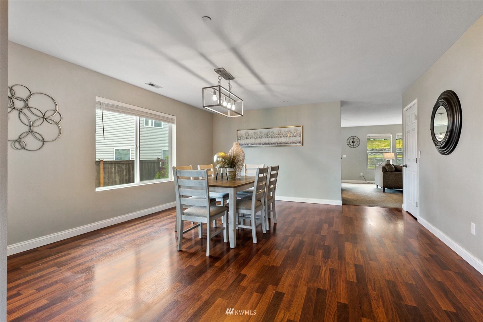 1360 Foreman Road DuPont, WA 98327 - Photo 4 of 33 a view of a dining room with furniture window and wooden floor