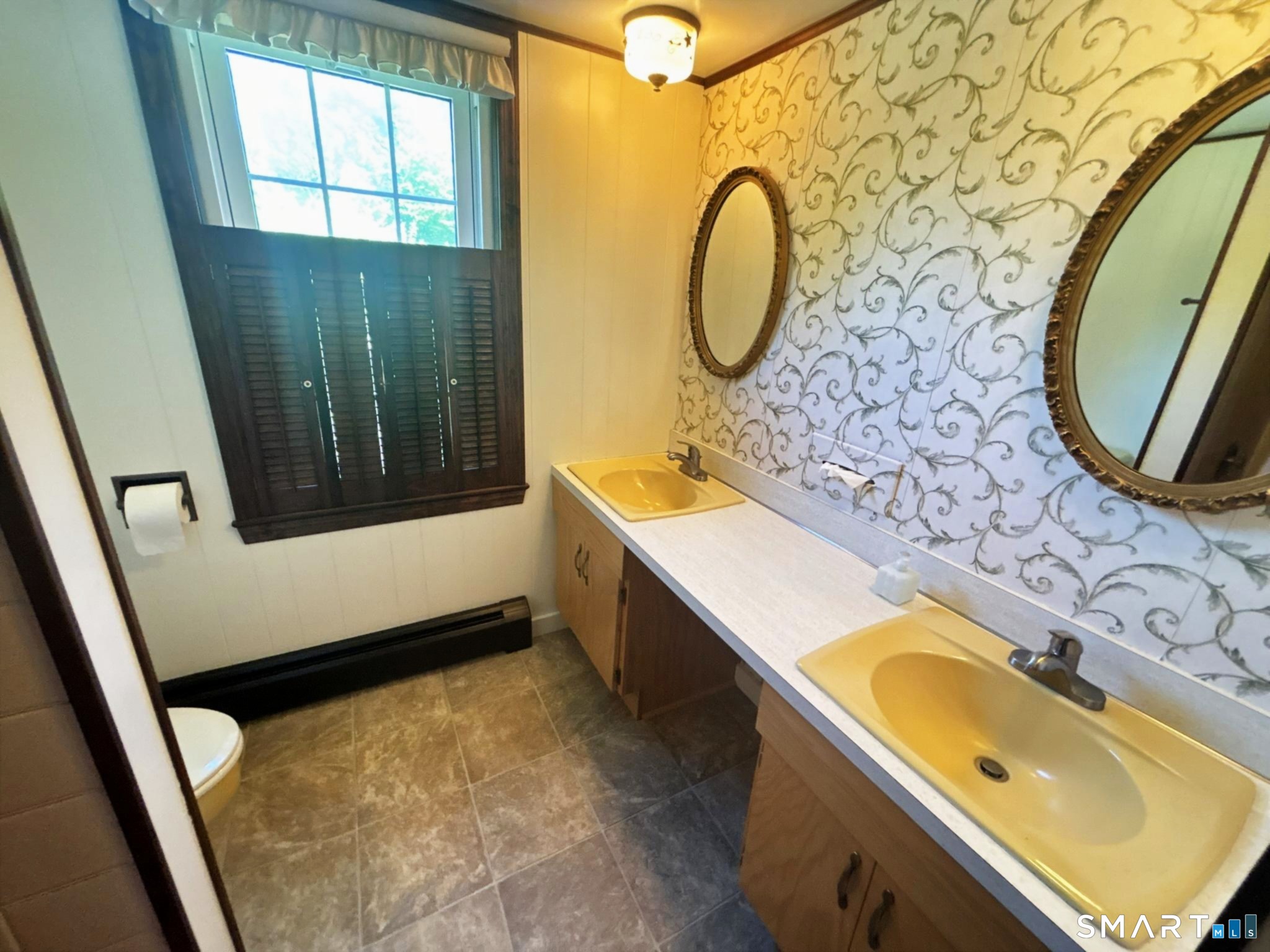 44 Summit Road Prospect, CT 06712 - Photo 17 of 40 a bathroom with a sink and a mirror