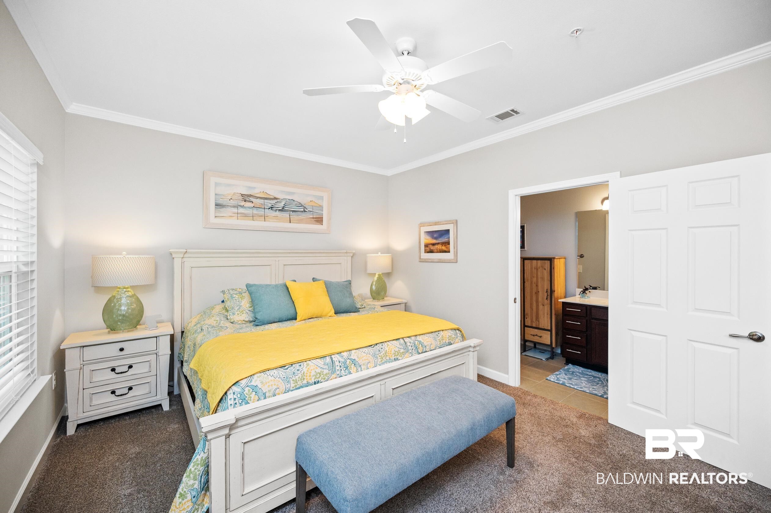430 West Fort Morgan Road, Unit 1902 Gulf Shores, AL 36542 - Photo 21 of 59 Bedroom featuring ceiling fan, ornamental molding, and light colored carpet