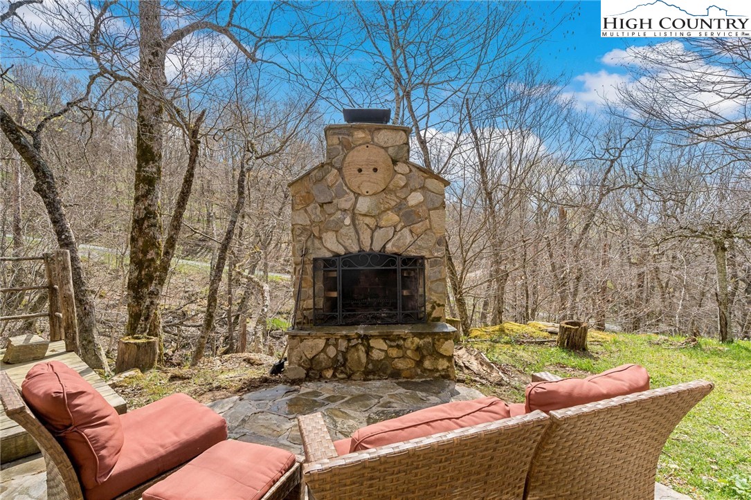140 Spruce Hollow Road Beech Mountain, NC 28604 - Photo 37 of 50 a view of a patio with a yard