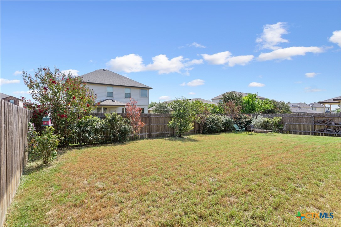 231 Druse Lane Jarrell, TX 76537 - Photo 36 of 38 a view of a house with a yard and garage