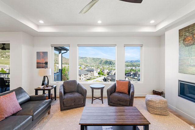 851 Grandview Drive Morgan, UT 84050 - Photo 15 of 68 Bright living space featuring multiple large windows showcasing a mountain and community backdrop