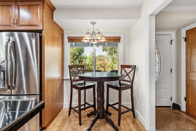 a view of a dining room with furniture window and outside view