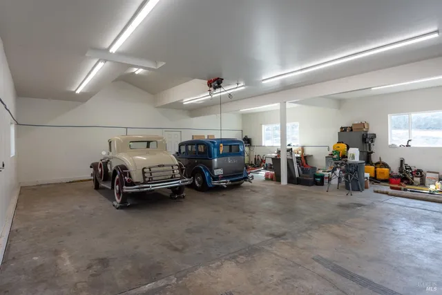 a view of a garage with parked cars