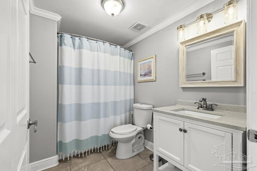 321 Gulfview Lane Perdido Key, FL 32507 - Photo 42 of 57 a bathroom with a toilet a sink and a mirror
