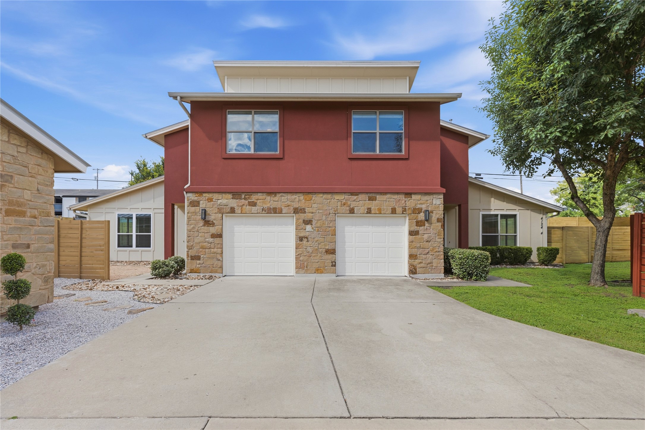 4124 Valley View Road, Unit 4A & 4B Austin, TX 78704 - Photo 39 of 40 A striking facade with warm red and stone accents offers inviting curb appeal.
