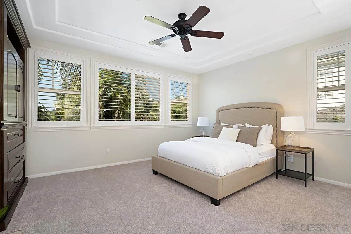 660 Cypress Hills Drive Encinitas, CA 92024 - Photo 13 of 38 a bedroom with a bed and a large window