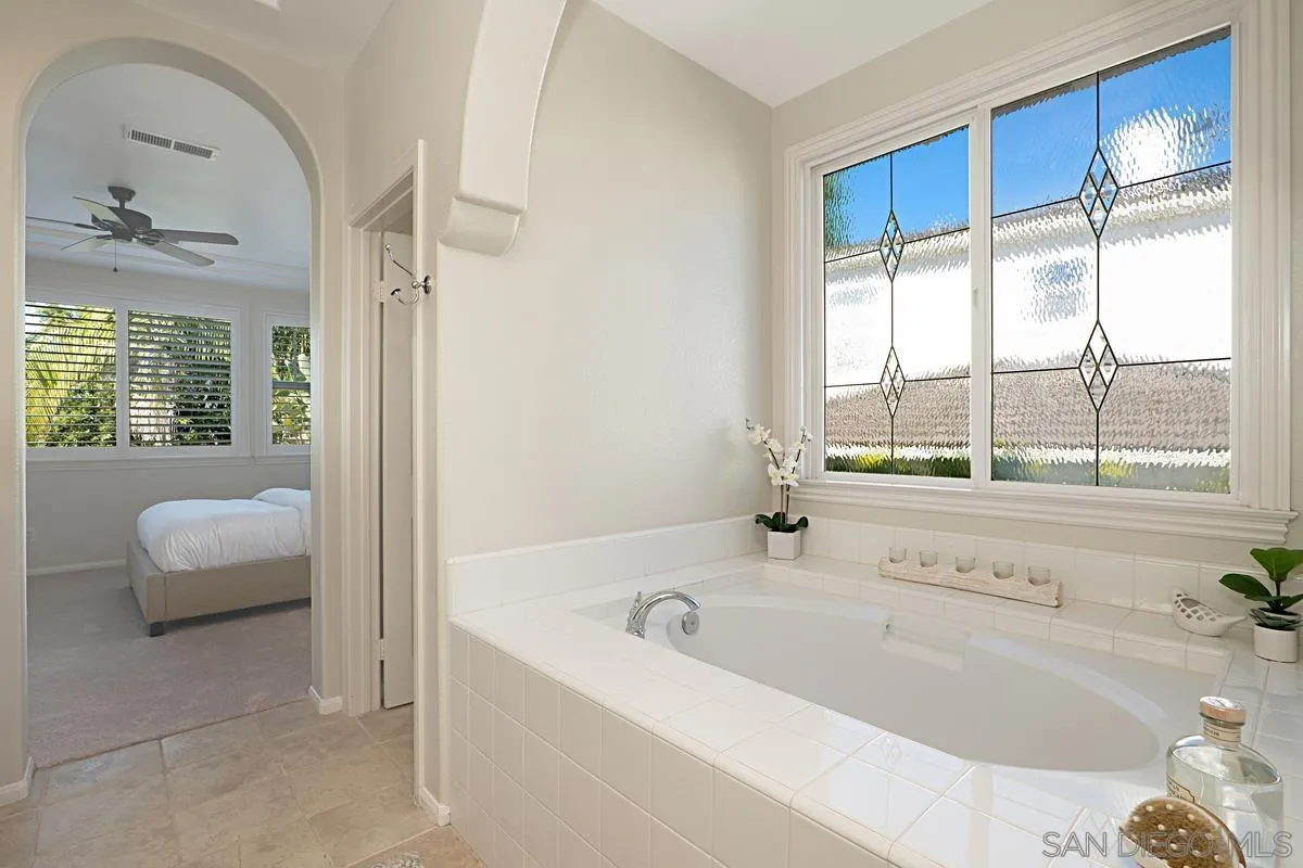 660 Cypress Hills Drive Encinitas, CA 92024 - Photo 17 of 38 a bathroom with a bathtub and a shower