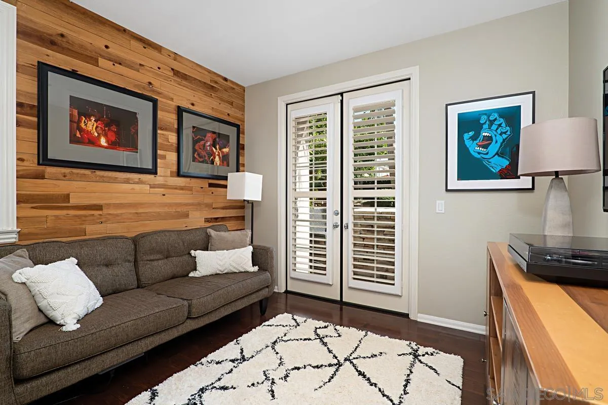 660 Cypress Hills Drive Encinitas, CA 92024 - Photo 20 of 38 a living room with furniture and a flat screen tv