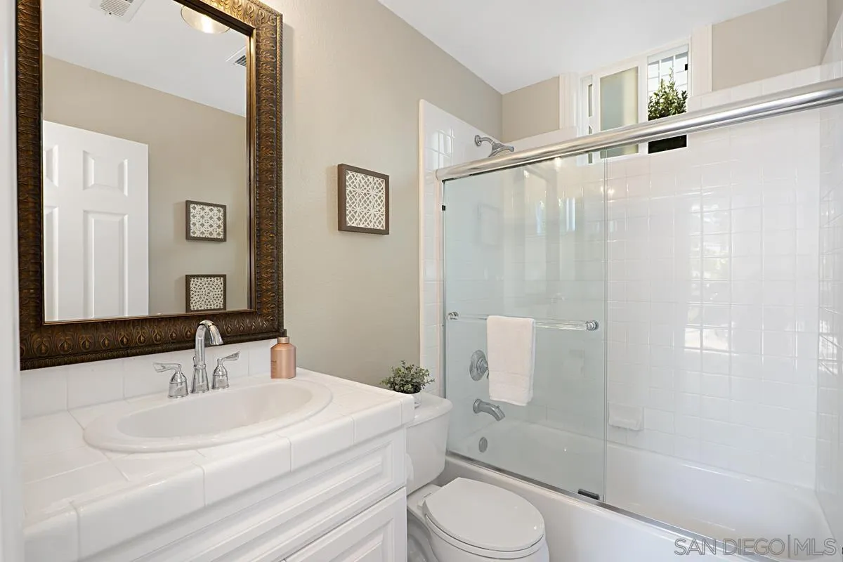 660 Cypress Hills Drive Encinitas, CA 92024 - Photo 21 of 38 a bathroom with a sink toilet and shower