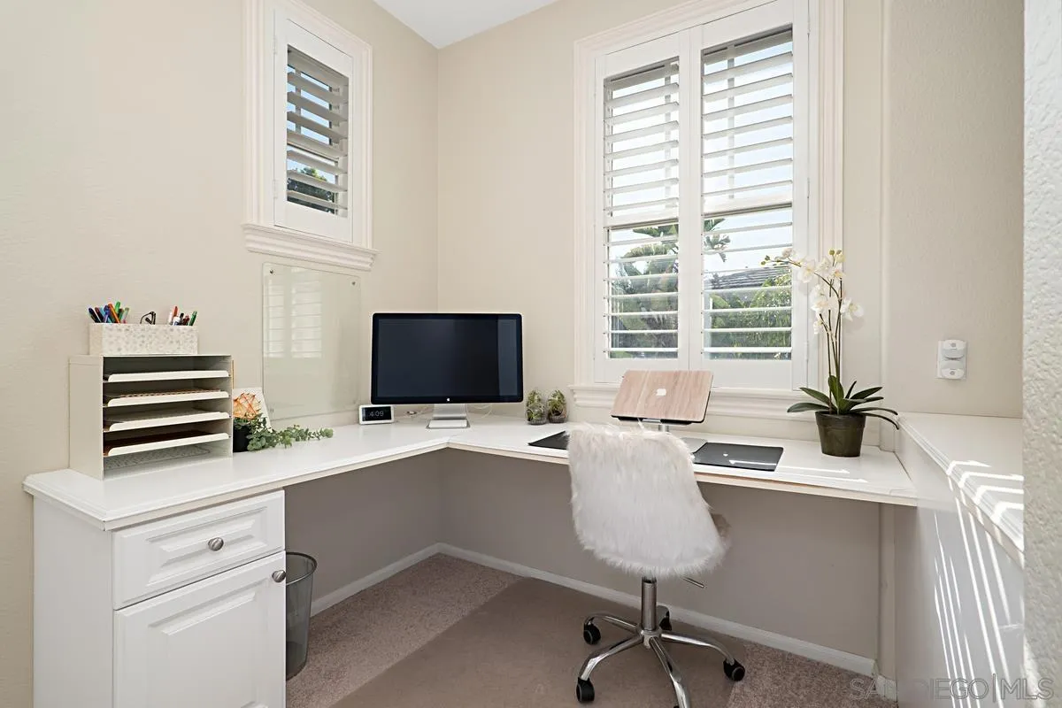 660 Cypress Hills Drive Encinitas, CA 92024 - Photo 25 of 38 a view of a workspace with furniture and a window