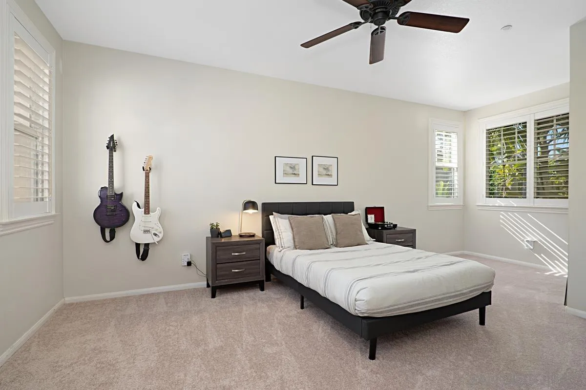660 Cypress Hills Drive Encinitas, CA 92024 - Photo 27 of 38 a bedroom with a bed and window