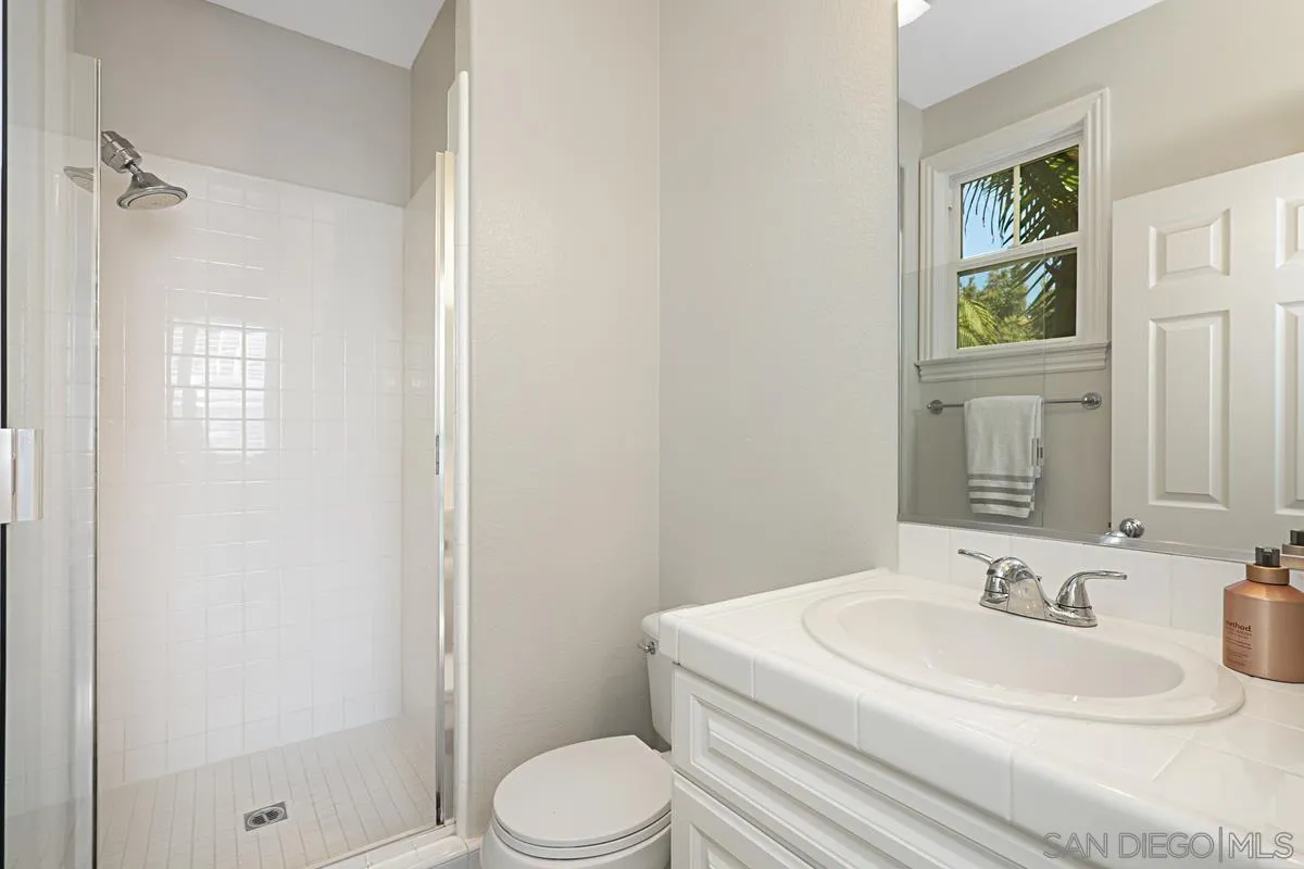 660 Cypress Hills Drive Encinitas, CA 92024 - Photo 29 of 38 a bathroom with a sink toilet and shower