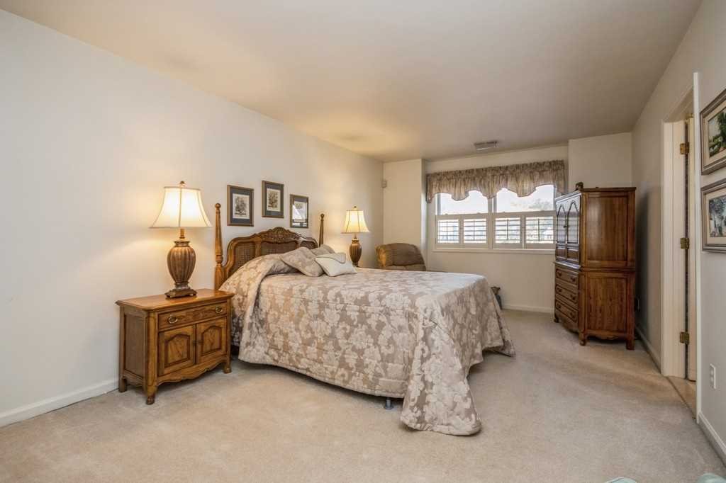 39 Deer Crossing Drive Fishkill, NY 12524 - Photo 21 of 35 a bedroom with a bed and a refrigerator